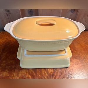 Vintage yellow stoneware lidded casserole dish and baking dish.